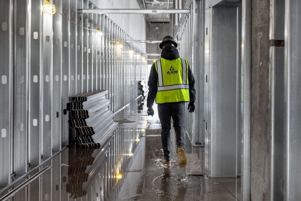 Axis Air heating and cooling employee walking through a hallway